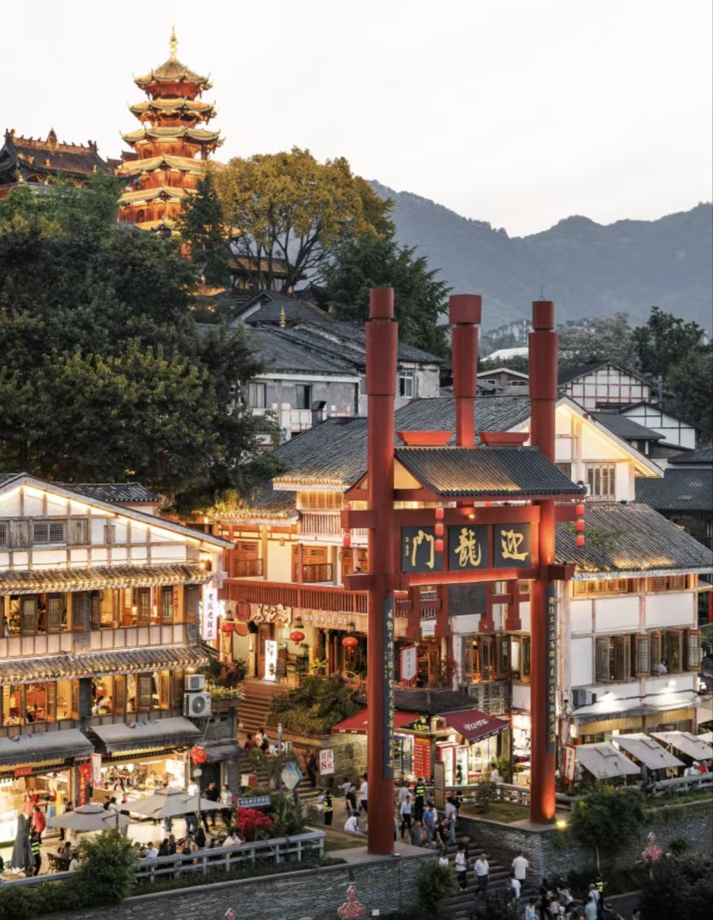 Riverside ancient town in Chongqing lit up at dusk