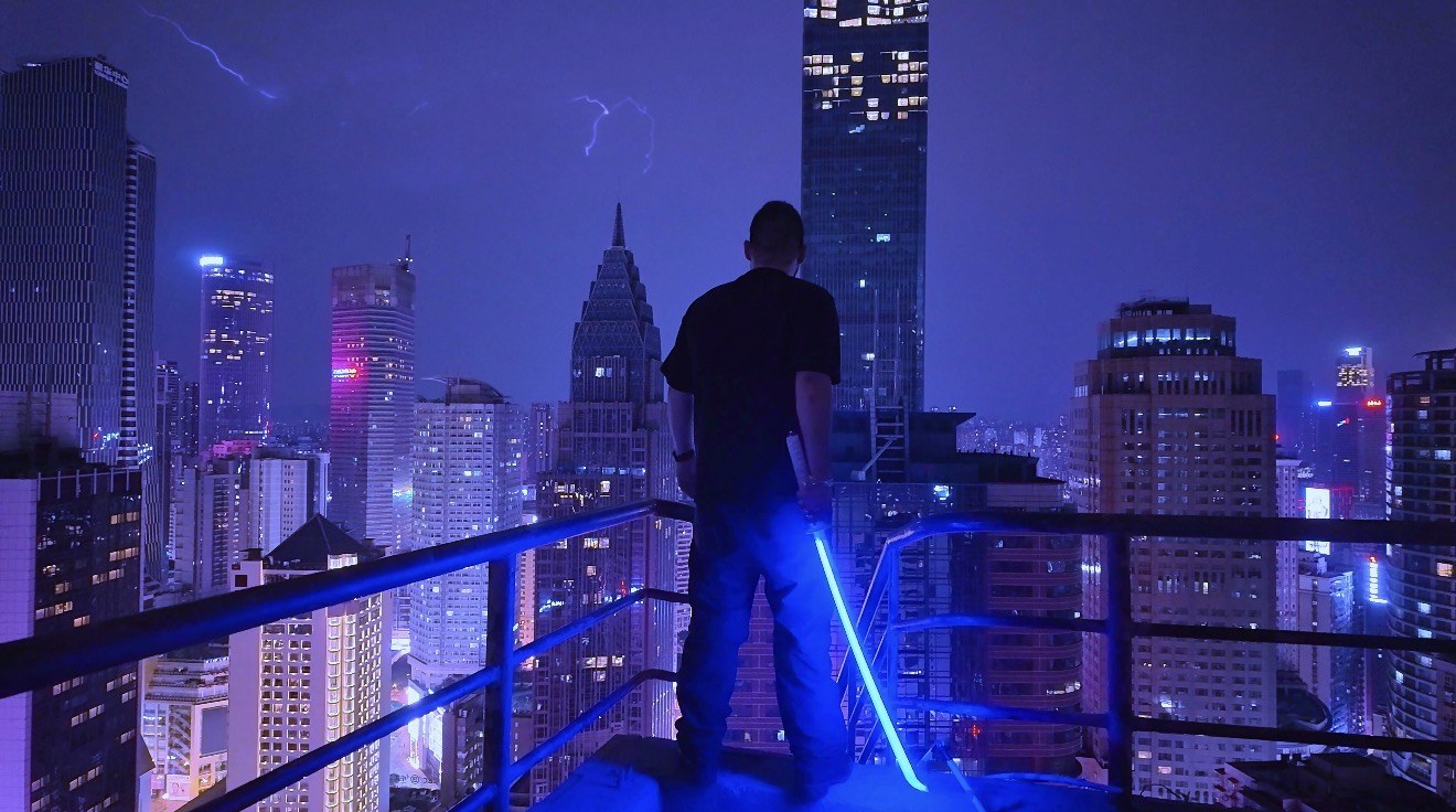Light-tube shoot as lightning hits the skyline