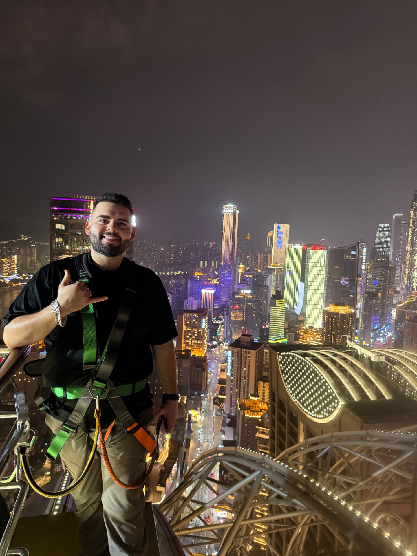 Harnessed above the Jiefangbei skyline at night