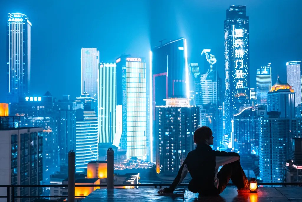 Lantern rooftop above the cyan skyline